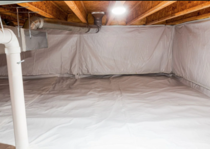 A well-lit crawlspace featuring a clean vapor barrier covering the ground and lower walls. The barrier is neatly installed, with no visible debris or damage, providing a moisture-protective layer in the crawlspace.