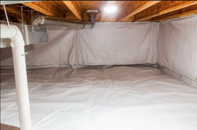 A well-lit crawlspace featuring a clean vapor barrier covering the ground and lower walls. The barrier is neatly installed, with no visible debris or damage, providing a moisture-protective layer in the crawlspace.