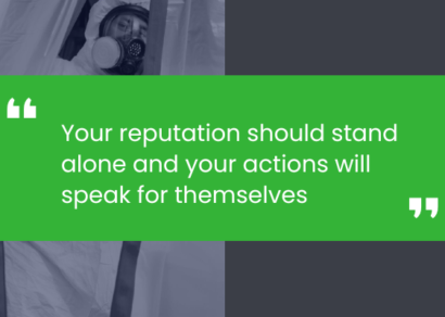 A mold specialist wearing a respirator and Tyvek suit. There is a quote from the president of The Solutions Group that says 